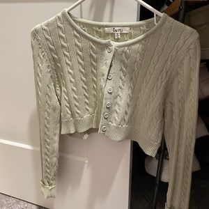 Cropped cable knit cardigan